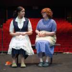 Hannah Burton and Ada Bon rehearse Our Town in the Soldotna High School Auditorium in Soldotna, Alaska, on Friday, April 18, 2025. (Jake Dye/Peninsula Clarion)