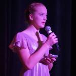 Sariah Henderson performs during the opening of the new Triumvirate Theatre in Kenai, Alaska, on Saturday, April 19, 2025. (Jake Dye/Peninsula Clarion)