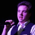 Jackson Hooper performs during the opening of the new Triumvirate Theatre in Kenai, Alaska, on Saturday, April 19, 2025. (Jake Dye/Peninsula Clarion)