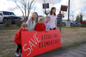 Students protest the possible closure of Sterling Elementary School along the Sterling Highway in Soldotna, Alaska, on Saturday, May 3, 2025. (Jake Dye/Peninsula Clarion)