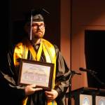 Joseph Reynolds is honored as Faculty Choice during the 55th Annual Kenai Peninsula College Commencement Ceremony, held at Kenai Central High School in Kenai, Alaska, on Thursday, May 8, 2025. (Jake Dye/Peninsula Clarion)