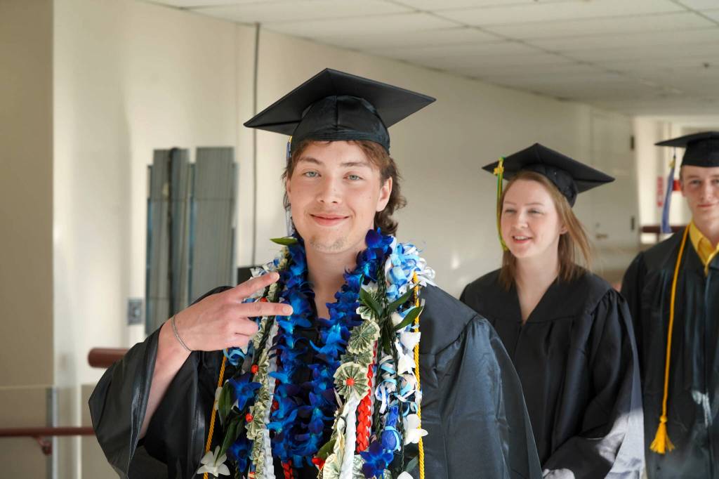 Graduates process into the 55th Annual Kenai Peninsula College Commencement Ceremony, held at Kenai Central High School in Kenai, Alaska, on Thursday, May 8, 2025. (Jake Dye/Peninsula Clarion)