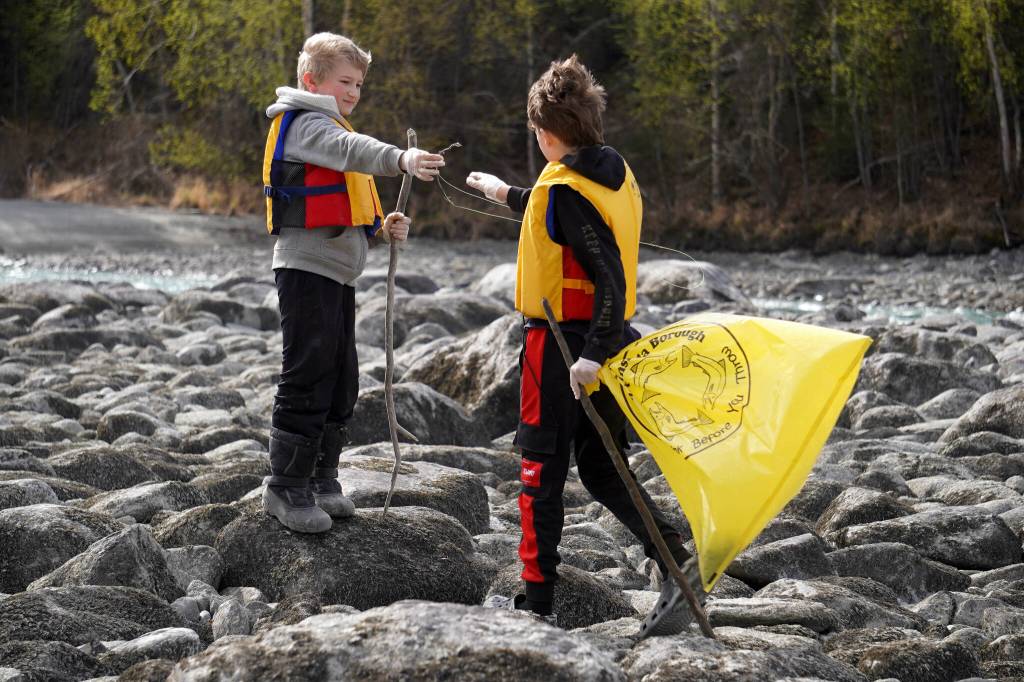 Sterling Elementary School students collect trash from the banks of the Kenai River near Bings Landing in Sterling, Alaska, during the 10th Annual Kenai River Spring Cleanup on Wednesday, May 14, 2025. (Jake Dye/Peninsula Clarion)