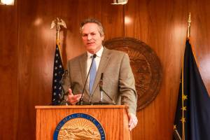Gov. Mike Dunleavy speaks to reporters about his decision to veto an education funding bill earlier this session at the Alaska State Capitol on Thursday, April 17, 2025. He vetoed a second such bill on Monday. (Jasz Garrett / Juneau Empire file photo)