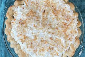 This decadent pie is made with rich coconut milk and a pile of sweetened whipped cream. (Photo by Tressa Dale/Peninsula Clarion)