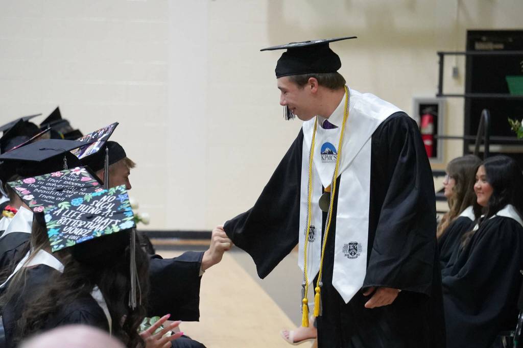 Nikiski valedictorian Wyatt Maguire greets his classmates before delivering an address during a commencement ceremony at Nikiski/Middle High School in Nikiski, Alaska, on Monday, May 19, 2025. (Jake Dye/Peninsula Clarion)