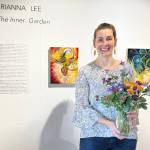 Artist Brianna Lee is photographed at the opening of her solo exhibit, The Inner Garden, on Friday, May 2, 2025, at Bunnell Street Arts Center in Homer, Alaska. Photo provided by Brianna Lee