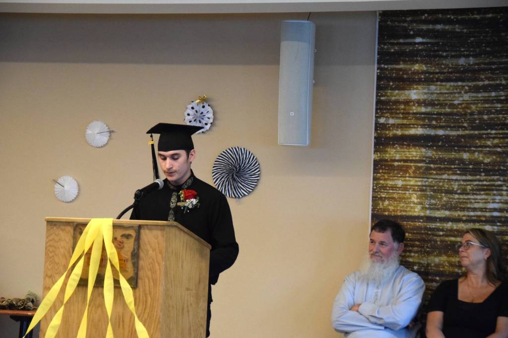 Irimey Reutov presents his graduation speech during the Voznesenka School commencement ceremony held Monday, May 19, 2025, at Lands End Resort in Homer, Alaska. (Delcenia Cosman/Homer News)