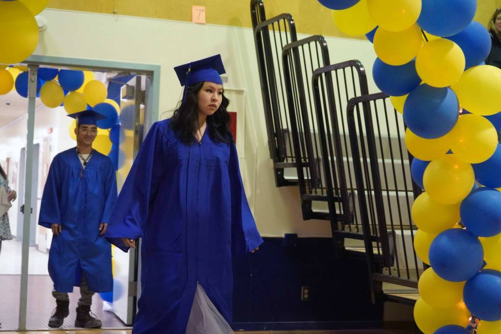 Kenai Alternative High School graduates process into their commencement ceremony in the schools gym in Kenai, Alaska, on Wednesday, May 22, 2025. (Jake Dye/Peninsula Clarion)