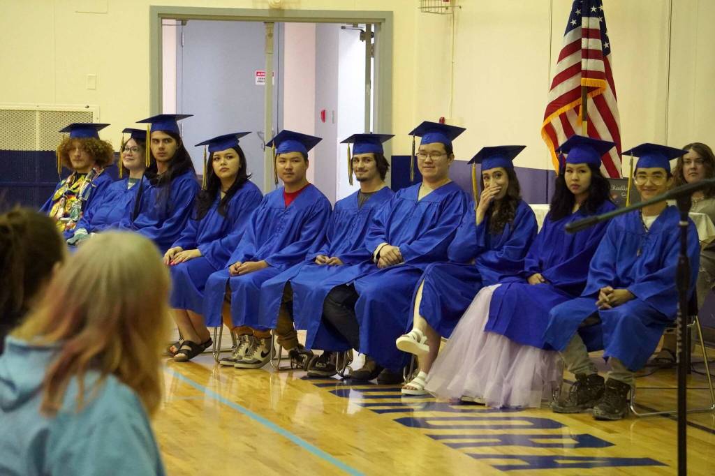 Kenai Alternative High School graduates take their seats during a commencement ceremony in the schools gym in Kenai, Alaska, on Wednesday, May 22, 2025. (Jake Dye/Peninsula Clarion)