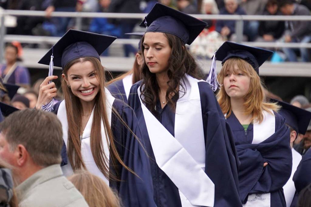 Graduates of Soldotna High School prepare to receive their diplomas on the schools football field in Soldotna, Alaska, on Wednesday, May 21, 2025. (Jake Dye/Peninsula Clarion)