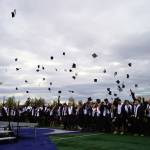 Graduates of Soldotna High School celebrate after receiving their diplomas on the schools football field in Soldotna, Alaska, on Wednesday, May 21, 2025. (Jake Dye/Peninsula Clarion)