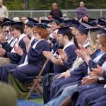 Graduates of Soldotna High School applaud during a commencement ceremony on the schools football field in Soldotna, Alaska, on Wednesday, May 21, 2025. (Jake Dye/Peninsula Clarion)