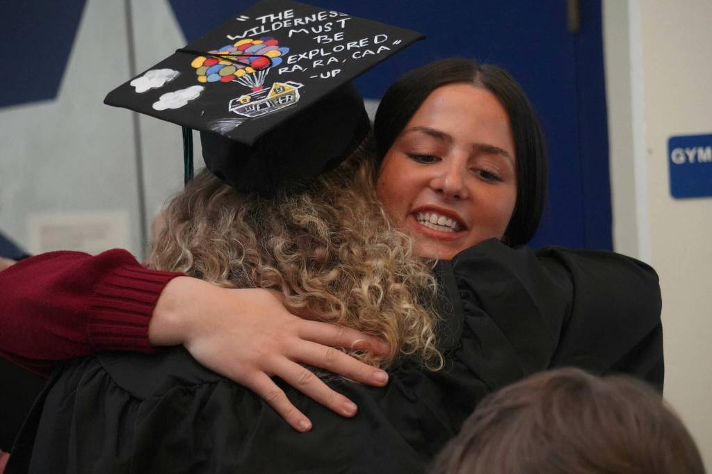 Students celebrate after a graduation ceremony for Connections Homeschool in Soldotna, Alaska, on Thursday, May 22, 2025. (Jake Dye/Peninsula Clarion)