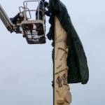 The 21-foot yellow cedar Fishermans Honor Totem Pole is unveiled in Hoonah on Friday, May 30, 2025. (Jasz Garrett / Juneau Empire)