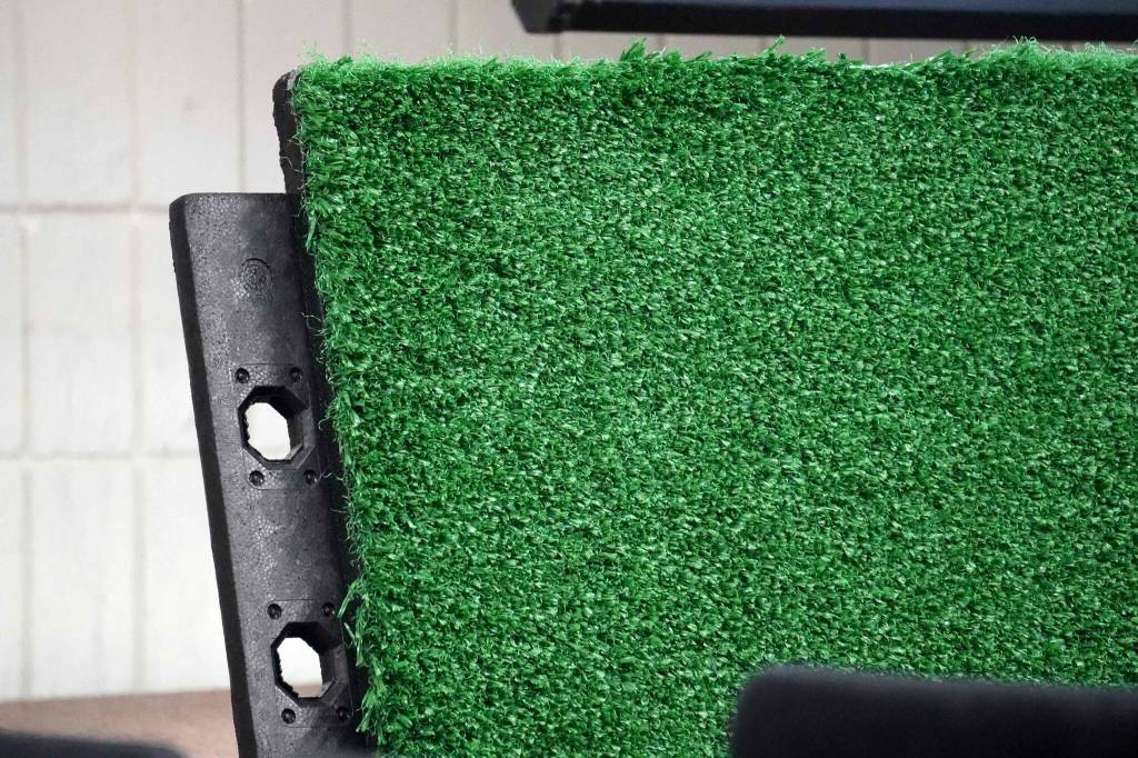 A panel of new turf flooring is displayed during a presentation on the Soldotna Field House at the Soldotna Regional Sports Complex in Soldotna, Alaska, on Wednesday, June 25, 2025. (Jake Dye/Peninsula Clarion)