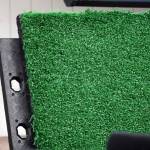 A panel of new turf flooring is displayed during a presentation on the Soldotna Field House at the Soldotna Regional Sports Complex in Soldotna, Alaska, on Wednesday, June 25, 2025. (Jake Dye/Peninsula Clarion)