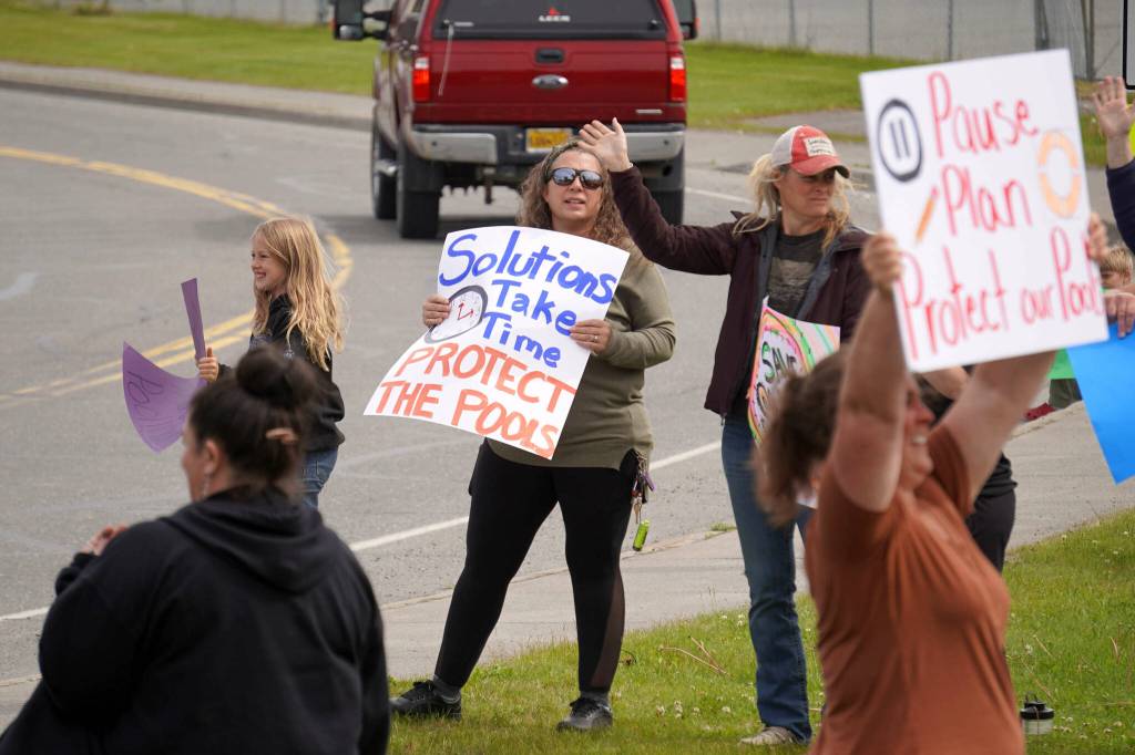 Swimmers and parents protest the proposed closure of Kenai Peninsula Borough School District pools outside of the Kenai Peninsula Borough Administration Building in Soldotna, Alaska, on Thursday, June 26, 2025. (Jake Dye/Peninsula Clarion)
