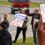 Swimmers and parents protest the proposed closure of Kenai Peninsula Borough School District pools outside of the Kenai Peninsula Borough Administration Building in Soldotna, Alaska, on Thursday, June 26, 2025. (Jake Dye/Peninsula Clarion)