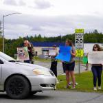 Swimmers and parents protest the proposed closure of Kenai Peninsula Borough School District pools outside of the Kenai Peninsula Borough Administration Building in Soldotna, Alaska, on Thursday, June 26, 2025. (Jake Dye/Peninsula Clarion)