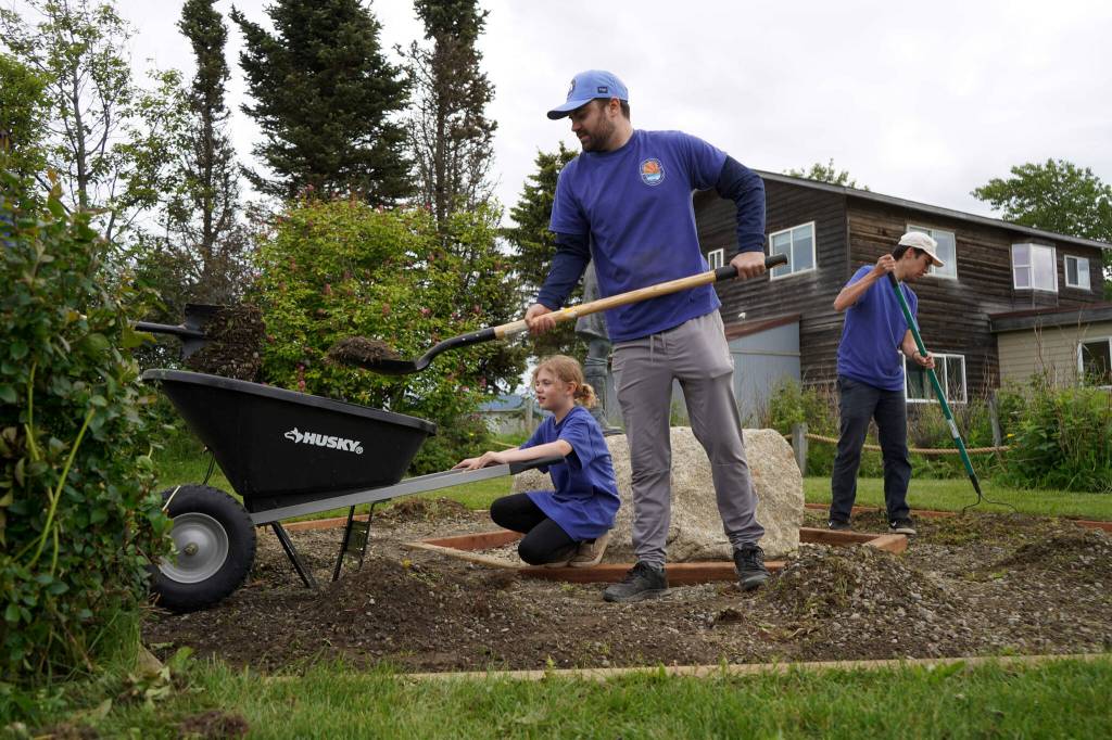 Volunteers repair the trails at Erik Hansen Scout Park in Kenai, Alaska, on Wednesday, June 25, 2025. (Jake Dye/Peninsula Clarion)