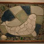 Clay and sea glass hang at the Kenai Potters Guild exhibit, River, hosted by the Kenai Art Center. (Jonas Oyoumick/Peninsula Clarion)