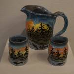 A clay pitcher set is on display during the Kenai Potters Guild exhibit, River, hosted by the Kenai Art Center. (Jonas Oyoumick/Peninsula Clarion)