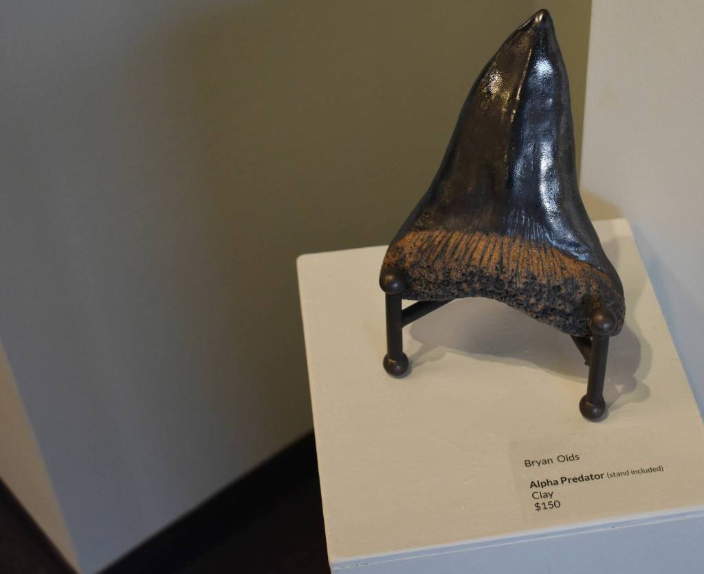 A big clay tooth stands on display at the Kenai Potters Guild exhibit, River, hosted by the Kenai Art Center. (Jonas Oyoumick/Peninsula Clarion)