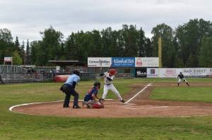 Daniel Steffensen bats against the Post 35 Road Warriors on Saturday at Coral Seymour Memorial Park as part of the 100th anniversary of American Legion Baseball in Alaska. (Jonas Oyoumick/Peninsula Clarion)