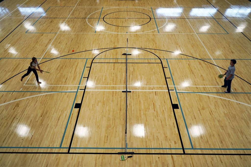 Children play pickleball during the grand opening of the Soldotna Field House in Soldotna, Alaska, on Saturday, Aug. 16, 2025. (Jake Dye/Peninsula Clarion)
