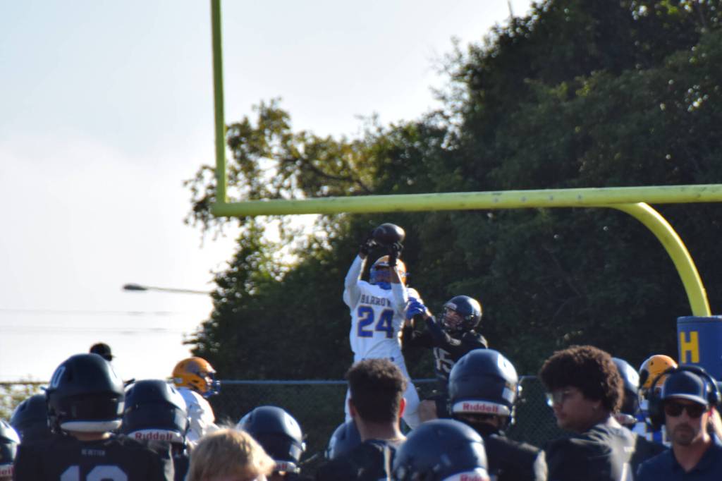 Barrows Malu Lauvao intercepts the ball . (Chloe Pleznac/Homer News)