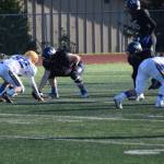 Barrows Jose Tuzroyluke faces off against Homers Timmy Cissney, backed by teammate David Webb. (Chloe Pleznac/Homer News)
