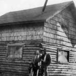 Howard and Maxine Lee, with their two children, pose behind their newly completed home in Soldotna in 1950. This structure, which became Soldotnas first post office, stood on part of the homestead that contained a large gravel pit that is now home to the Kenai Peninsula Boroughs administration building. (Photo Soldotna Historical Society)