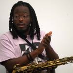 Joseph Miller encourages the audience to clap along during a jazz workshop put on by Svetlana and the New York Collective at the Soldotna Public Library in Soldotna, Alaska, on Tuesday, Aug. 26, 2025. (Provided by KDLL 91.9 FM)
