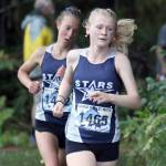 Soldotnas Sophia Jedlicki leads Tania Boonstra at the George Plumley Invite at Palmer High School in Palmer, Alaska, on Saturday, Sept. 6, 2025. (Photo by Jeremiah Bartz/Frontiersman)