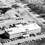 This aerial photo, courtesy of the Kenai Historical Society, shows the Kenai Peninsula Borough administration building in its early days, likely in the 1970s. The building was completed in 1971.