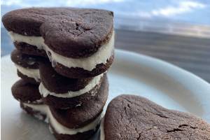 These heart-shaped chocolate sandwich cookies go perfectly with a glass of milk. (Photo by Tressa Dale/Peninsula Clarion)