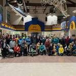 Runners of all ages gather for a photo in the Homer High School Commons after the annual Thanksgiving Turkey Trot on Thursday, Nov. 27, 2025, in Homer, Alaska. Due to icy outdoor conditions, the official run was moved inside to the high school halls. Photo courtesy Matthew Smith