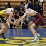A Homer athlete wrestles against a Grace Christian athlete during the regional Kachemak Conference Wrestling Championships on Saturday, Dec. 13, 2025, at Homer High School in Homer, Alaska. (Delcenia Cosman/Homer News)