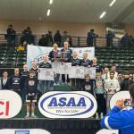 Photo courtesy of Andie Bock/Andies Alaskan Adventures Photography
The Soldotna High School boys wrestling team stands on the podium after placing second in the ASAA Division I state championships in Anchorage on Dec. 20. The Student Wrestler Development Program in Fairbanks beat the Stars by 29.5 points.
