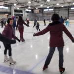 Community members enjoy skating at Kevin Bell Arena during the Christmas Eve community free skate on Wednesday, Dec. 24, 2025, in Homer, Alaska. (Delcenia Cosman/Homer News)