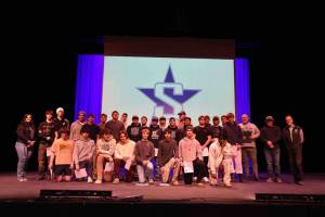 The Soldotna High School varsity football team receives certificates of achievement, presented on Tuesday, Jan. 13, 2026,  by Kenai Peninsula Borough Mayor Peter Micciche (right) and KPB Assembly member Sargeant Truesdell, for winning the Division II State Championship in October 2025. Photo courtesy Joe Rizzo