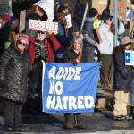 Protesters carry signs and flags during the ICE OUT demonstration on Sunday, Feb. 1, 2026, at WKFL Park in Homer, Alaska. (Delcenia Cosman/Homer News)