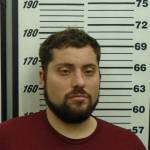 A police mugshot of Kirby Calderwood, 36, of Ogden, Utah, the man charged in the murder and kidnapping of Anesha Duffy Murnane. (Photo provided/Homer Police)