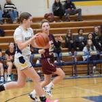 Sophomore Abby Ostrom runs the ball down the court during the varsity game against Grace Christian on Saturday, Feb. 7, 2026, during the annual Winter Carnival basketball tournament in the Alice Witte Gymnasium at Homer High School in Homer, Alaska. (Delcenia Cosman/Homer News)