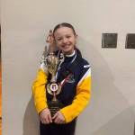 Laila Taylor poses with her third-place trophy from the Elks National Hoop Shoot semi-finals in Nampa, Idaho on March 15, 2025. (Photo provided by Amber Rouswell)