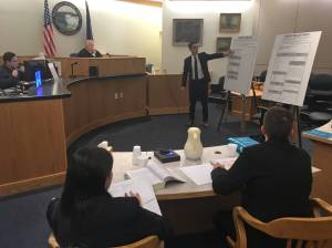 State attorneys Elizabeth Bakalar, foreground left, and Margaret Paton-Walsh, foreground right, listen to arguments made by attorney Jon Choate on Thursday, Sept. 21, 2017 in Alaska Superior Court in Juneau. At background left is Judge Philip Pallenberg, who is expected to decide the Alaska Democratic Party&rsquo;s lawsuit against the state next week. (James Brooks | Juneau Empire File)