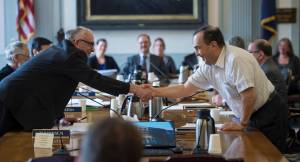 Conference Committee members Rep. Steve Thompson, R-Fairbanks, left, shakes hands with Sen. Donald Olson, R-Golovin, after the committee finished its work on the budgets at the Capitol on Thursday, May 10, 2018. (Michael Penn | Juneau Empire)